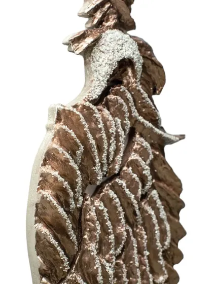 A close-up of the diamond-encrusted head and textured wings of "The Bronze Guardian." The details are essential to capturing its majestic character.