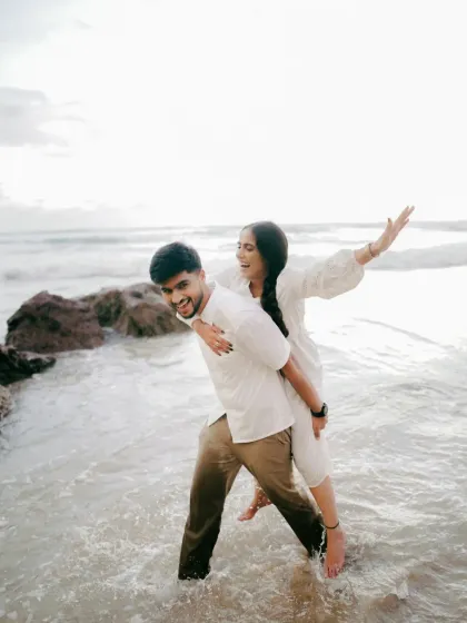 A playful piggyback ride in the waves. Pre-wedding shoots are a chance to let go and have fun, and I'm there to capture that authentic, carefree spirit.