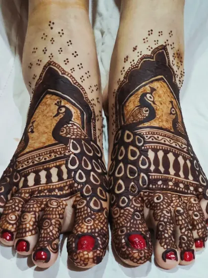 Your bridal mehendi isn't complete without beautiful feet. I designed this piece with graceful peacocks whose feathers flow down to the toes, creating an elegant pattern that looks stunning with open-toed shoes.