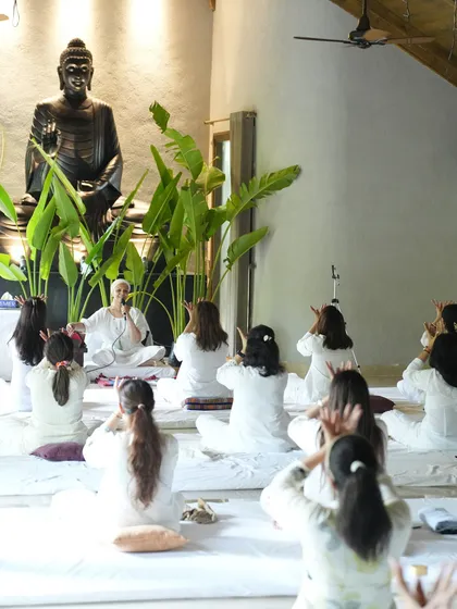 Students practicing a kriya together. The synchronized movement and breath create a powerful, unified energy field.