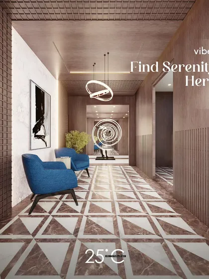 We designed this hallway to be more than just a passage, creating a serene experience with patterned floor tiles, textured wall panels, and a comfortable seating nook. A modern sculpture at the end of the hall acts as a compelling focal point.