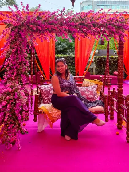 Taking a moment on the beautifully decorated Mehendi swing. The festive decor inspires my performance and helps create a magical atmosphere.