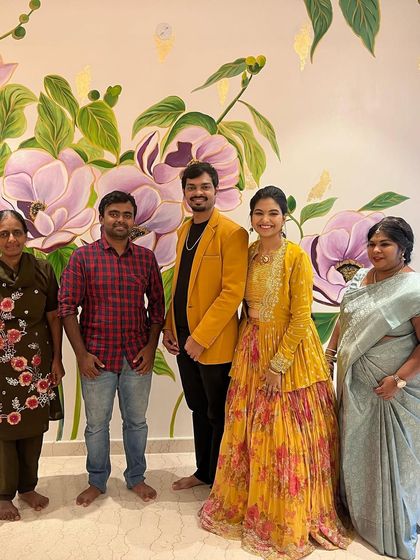 A photo with the happy clients and my mother. It's a joy to create art that becomes a backdrop for a family's memories.