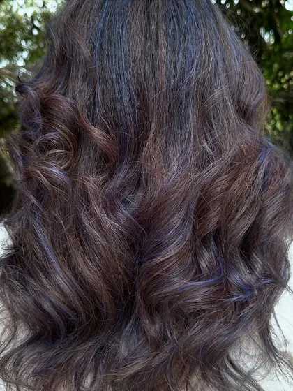 For my experimental clients like Bhakti, we love to play. This time we went for a cool purple and blue mix on her curly hair. The color looks so different after a few washes, fading into a beautiful pastel tone.