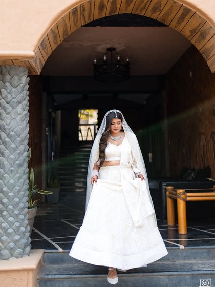 Another beautiful full length shot as she walks, showcasing the flow of her lehenga.
