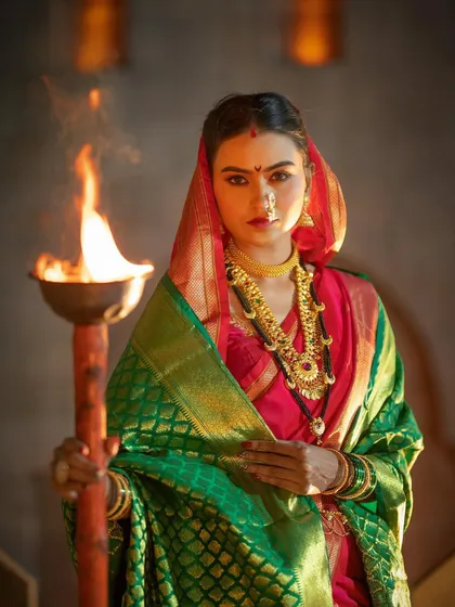 As an artist, I love bringing powerful concepts to life. This 'Shivkanya' photoshoot captures the strength and spirit of Maharashtrian heritage, blending traditional attire with dramatic, expressive makeup.
