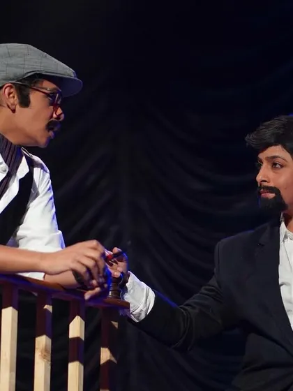 Character interaction is key to storytelling. Here, two actors from 'Khamosh Adalat Jari Hai' are deep in a crucial dialogue.