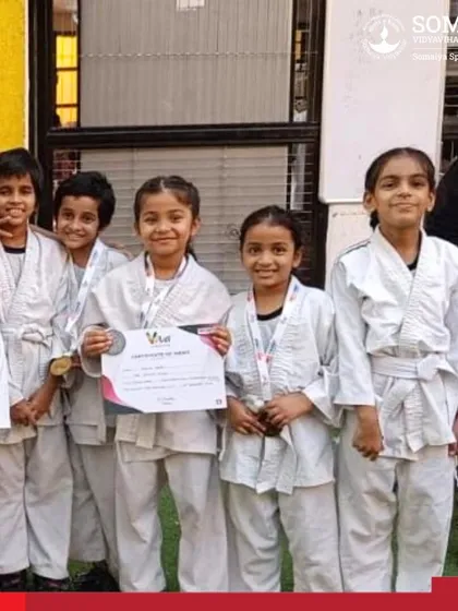 A group of our junior girl judokas proudly showing their certificates and medals from the Inter School Judo Championship.