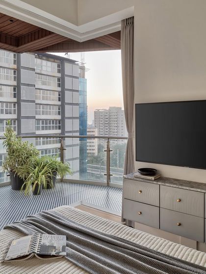 One of the standout features of this master bedroom is the increased height and tall windows. They allow an abundance of natural light to flood the room, revealing stunning panoramic views and making every morning feel like a dream.