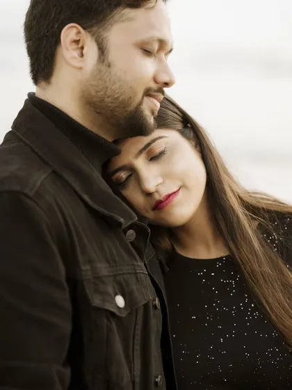 Finding a moment of peace together. Her head resting on his chest shows a deep sense of trust and belonging, a beautiful sentiment to capture before marriage.