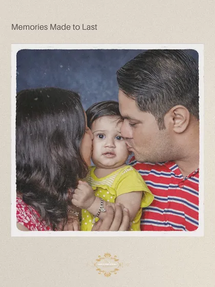 An intimate family moment with parents kissing their baby's cheeks. This studio-quality shot was captured in the comfort of the family's own home.