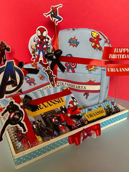 A superhero-themed birthday hamper that's sure to be a hit with the little ones. This Avengers set includes a personalised backpack, stationery, and other fun goodies, all packed in a themed tray with a custom birthday tag.