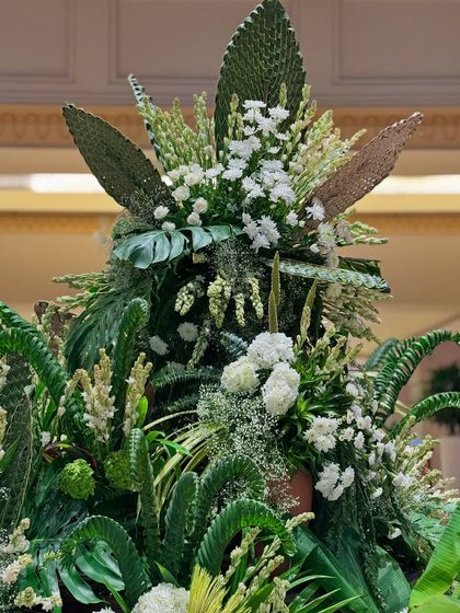 The top of the green installation, where different leaves are used to create a sculptural and architectural shape.