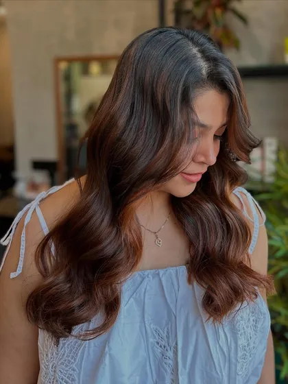 A beautiful portrait of the client with the Cinnamon Sugar color, showing how the warm tones brighten her complexion.