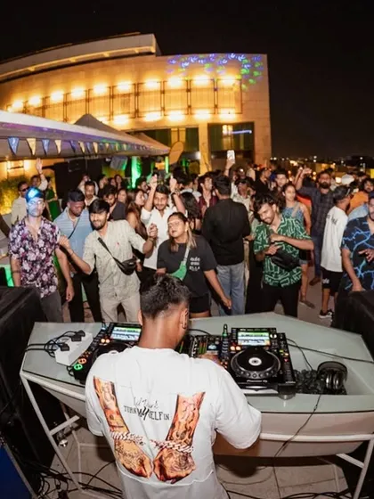 A duplicate shot capturing the full scene at the rooftop event, showcasing the lively atmosphere and my setup.