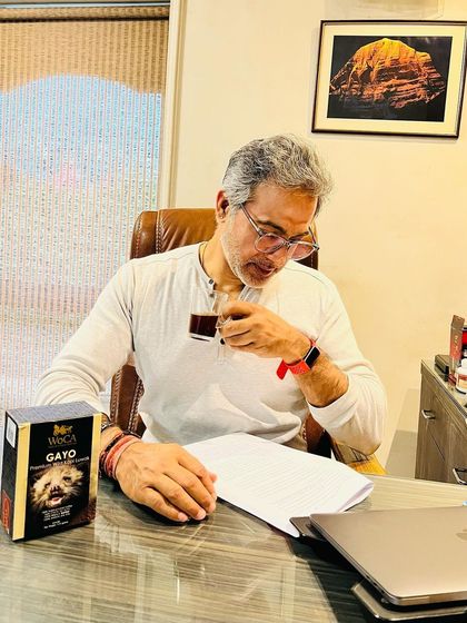 Reviewing case files with a cup of coffee. My children know my love for coffee, and this was a fun moment they captured of me modeling with a new blend.