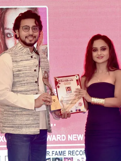 Posing with my award for 'Best Painting Artist of the Year' at the Gee Awards. I am grateful for the recognition.