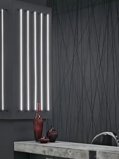 A wider shot of the showroom, highlighting the raw, industrial textures and the dramatic interplay of light and shadow. The design is edgy, raw, and sophisticated.