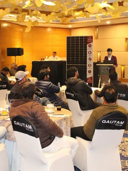 Another view of our expert presenting at the tech workshop in Jammu, with our high-efficiency solar panel on display for attendees to examine.