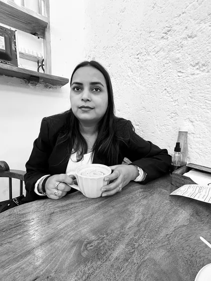A black and white photo from the same cafe visit. It captures a more contemplative side to my personality, balancing the fierce advocate persona.