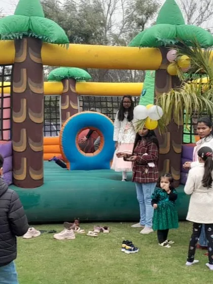 Kids enjoying the spacious jungle bouncy castle at an outdoor birthday party. I handle the complete setup and takedown, so you can focus on the event.