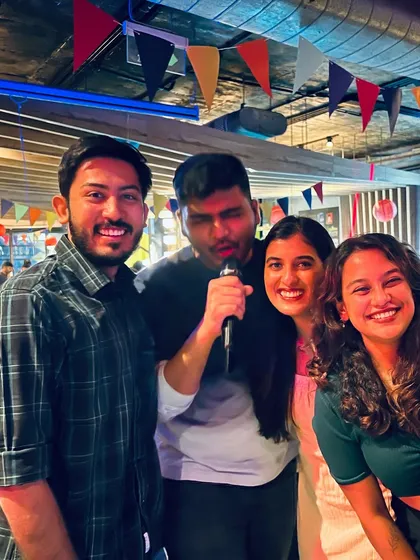A group of friends celebrating a great performance during our Justin Bieber-themed karaoke night. The energy and smiles say it all.