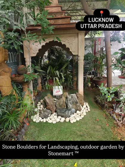 This image shows how our stone boulders can be used to create an inviting and naturalistic feature in any outdoor garden or landscape project.