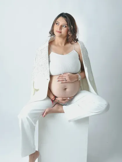 For the modern mother who is bold and confident. This vogue inspired maternity look with a stylish white pantsuit showcases your power and grace, proving that pregnancy is the most beautiful fashion statement.