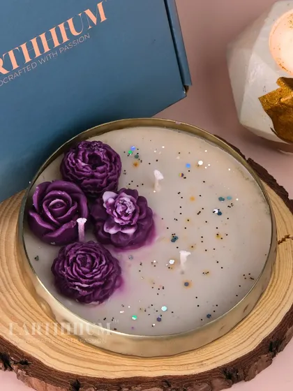A deep purple floral urli, sprinkled with glitter for a touch of festive magic. This one is perfect for evening celebrations.