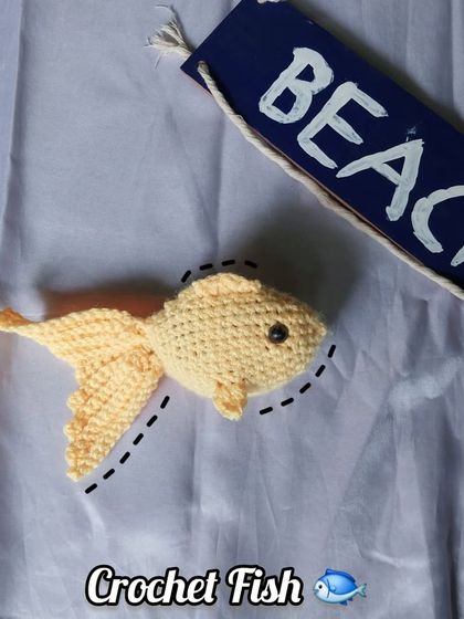 A top-down view of the crochet fish, perfect for showing its shape and fins.
