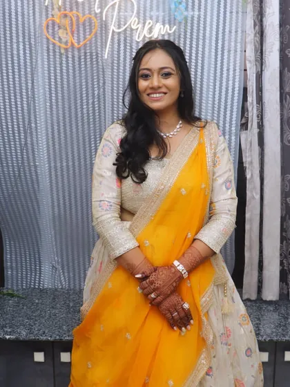 The client looking happy and radiant at her engagement party. The makeup is designed to look flawless in every photo.