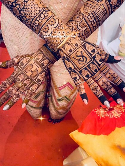 This checkerboard design is filled with tiny, meaningful symbols for the couple, including their initials 'VS' and auspicious wedding icons.