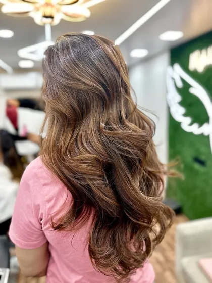 Another look at a classic balayage transformation. The soft waves really make the hand painted highlights pop, creating a beautiful, textured style.