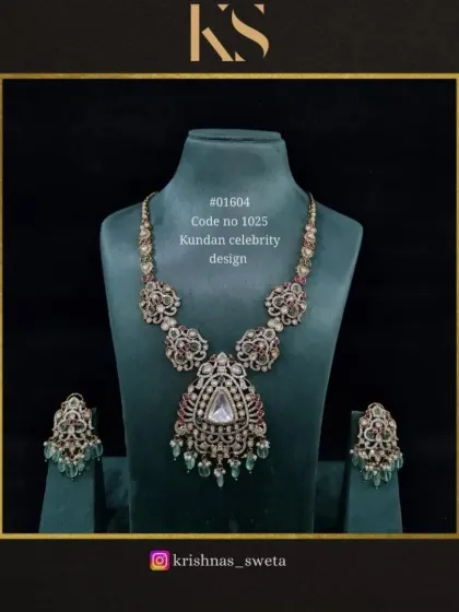 A Kundan celebrity design set with a beautiful mix of ruby and emerald stones. This necklace and earring set has a vintage feel, perfect for a sophisticated and elegant look.