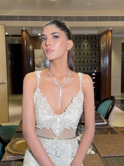 Another view of the sleek ponytail, a versatile and modern choice for any formal event.