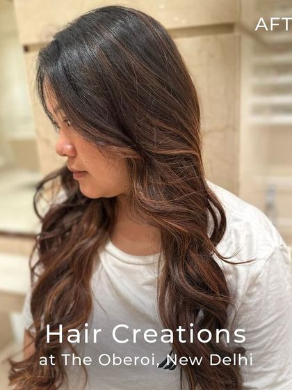 The stunning result of a copper and chestnut colour blend. The soft waves enhance the rich tones, creating a look full of movement and shine.