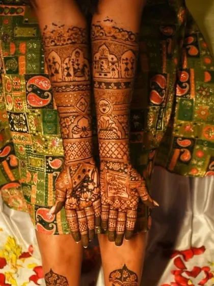 A full bridal look, including hands and feet. The hands feature bands of different traditional motifs, telling a story up the arms.