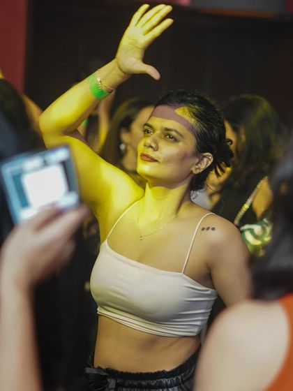 A guest dancing under the spotlight at Hardrock Cafe.