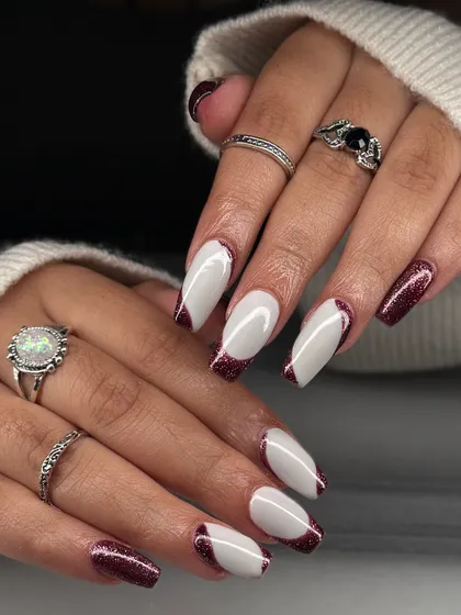 The full two-hand view of this bold and modern French manicure. It's a perfect example of how creative you can get with a classic design.