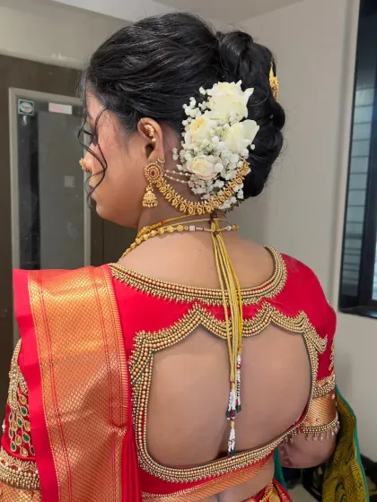 Another angle of the floral bun, showing how the accessories and flowers are placed to create a balanced and beautiful look.