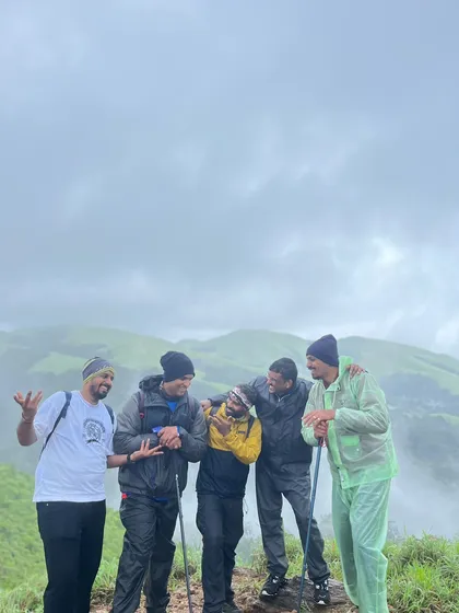 Friends having a laugh on the trail, capturing the fun and camaraderie of the Bandaje trek.