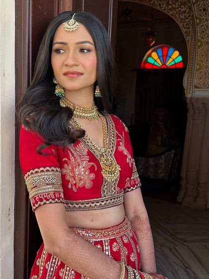 Aashna’s side profile, showing the soft contour and the gentle waves in her hair. This minimal bridal style is perfect for the modern bride who values timeless beauty.