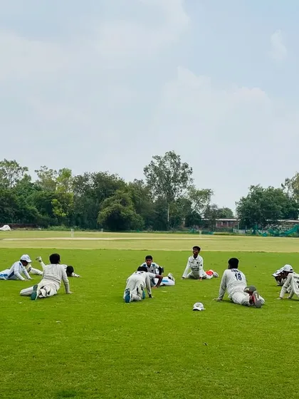 The team stretching together before a match. A proper warm-up and stretching routine is essential to prevent injuries and prepare the body for the game.