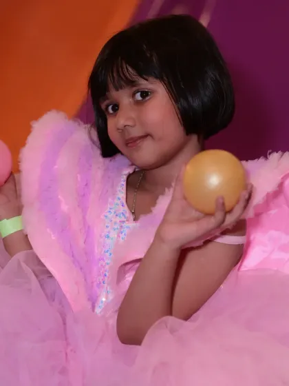A candid shot of a guest enjoying the ball pit. The combination of colors and the sheer number of balls make it an irresistible attraction.