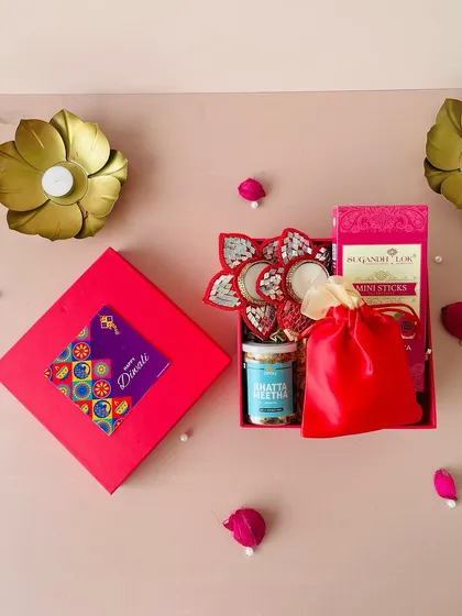 This flat-lay shows the complete red combo Diwali box. It’s a simple, budget-friendly option that is still packed with festive charm.