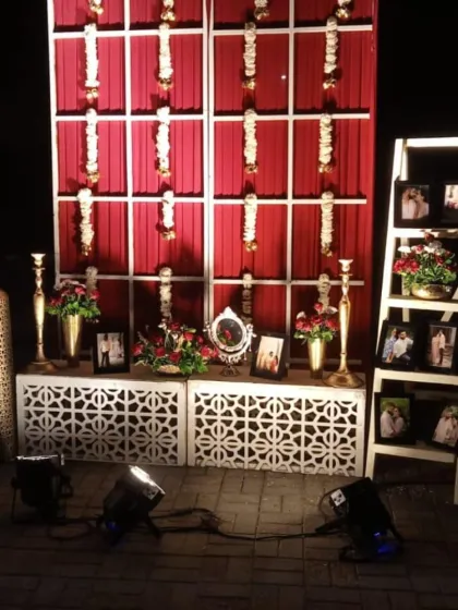 A personalized photo corner with a ladder display for pictures of the couple, a wonderful way to share your journey.