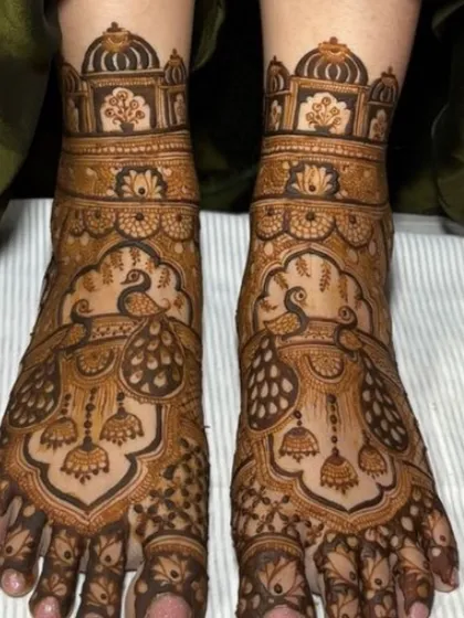 A beautiful foot design with peacock and jhumka motifs.