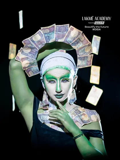 A powerful pose from the money-themed fantasy shoot. The halo of currency notes and the confident expression create a memorable and thought-provoking image.