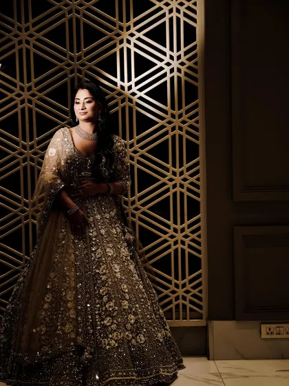 A dramatic solo portrait of the bride-to-be, using shadows and light to create a moody and artistic image.