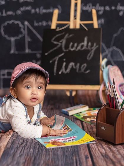 Exam time! This little student is hitting the books in our fun and creative school-themed studio.